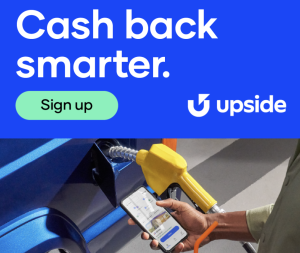 Advertisement for Upside featuring a smartphone displaying the app while a person holds a gas pump
